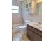 Bathroom with a tub/shower combination, vanity, and built-in storage cabinet at 2029 Willow Oak Dr, Edgewater, FL 32141