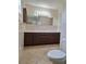 Bathroom featuring a double sink vanity with ample counter space and storage at 2029 Willow Oak Dr, Edgewater, FL 32141