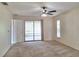 Bedroom with sliding glass doors leading to a patio, plus ceiling fan at 2029 Willow Oak Dr, Edgewater, FL 32141