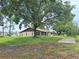 A cozy single-story home with a spacious yard and mature trees at 2029 Willow Oak Dr, Edgewater, FL 32141