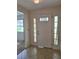 Foyer with tile flooring, a front door with decorative glass, and side lights at 2029 Willow Oak Dr, Edgewater, FL 32141