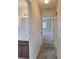 Hallway with bathroom on the left and bedroom at the end at 2029 Willow Oak Dr, Edgewater, FL 32141