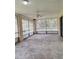 A screened porch offers outdoor seating and entertainment space at 2029 Willow Oak Dr, Edgewater, FL 32141