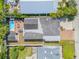 An aerial view of the home showcasing the pool, outdoor living area, and the structure's roof at 206 Kirkland Rd, New Smyrna Beach, FL 32169