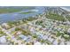 An aerial view showing the neighborhood with the river and ocean in the background on a clear day at 206 Kirkland Rd, New Smyrna Beach, FL 32169