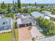 Aerial view of a home with a brick driveway, low-maintenance yard, and surrounded by mature trees at 206 Kirkland Rd, New Smyrna Beach, FL 32169