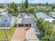 Aerial view of a home with a brick driveway, low-maintenance yard, and surrounded by mature trees at 206 Kirkland Rd, New Smyrna Beach, FL 32169