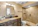 Bathroom featuring granite countertops, wood cabinet, and glass enclosed tiled shower at 206 Kirkland Rd, New Smyrna Beach, FL 32169