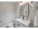 Charming bathroom featuring a stylish vanity with a marble countertop and a modern black faucet at 206 Kirkland Rd, New Smyrna Beach, FL 32169