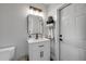 Clean and modern bathroom with a vanity and framed mirror at 206 Kirkland Rd, New Smyrna Beach, FL 32169