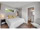 Bright bedroom with a large window view and neutral color scheme at 206 Kirkland Rd, New Smyrna Beach, FL 32169