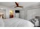 Bedroom featuring queen bed with white comforter, seating area, and closet at 206 Kirkland Rd, New Smyrna Beach, FL 32169