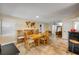 Spacious dining area with wooden table and chairs, tile flooring, and natural light at 206 Kirkland Rd, New Smyrna Beach, FL 32169