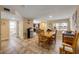Open layout of the dining area with tile flooring, connecting to the kitchen and living spaces at 206 Kirkland Rd, New Smyrna Beach, FL 32169