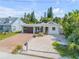 Inviting single-Gathering home with a modern garage door, landscaped front yard and bright exterior at 206 Kirkland Rd, New Smyrna Beach, FL 32169