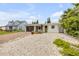 Charming single-story home with a modern design, white exterior, and gravel landscaping at 206 Kirkland Rd, New Smyrna Beach, FL 32169