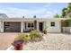 Charming single-story home with a modern design, white exterior, and gravel landscaping at 206 Kirkland Rd, New Smyrna Beach, FL 32169