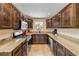 Bright and well-lit kitchen with stainless steel appliances, granite countertops, and tile flooring at 206 Kirkland Rd, New Smyrna Beach, FL 32169