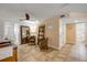 Bright living room with neutral paint, tile flooring, accent chairs, and doorway to the bathroom at 206 Kirkland Rd, New Smyrna Beach, FL 32169