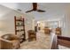 Open-concept living room with tile flooring, neutral paint, and a view into the kitchen and dining area at 206 Kirkland Rd, New Smyrna Beach, FL 32169