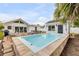 Charming pool situated between the main house and a quaint pool house at 206 Kirkland Rd, New Smyrna Beach, FL 32169