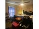 Bedroom with cozy bed, window, ceiling fan and dark wood furnishings at 2122 Orange Tree Dr, Edgewater, FL 32141