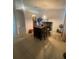 Bright dining room featuring tile flooring and a view into the kitchen at 2122 Orange Tree Dr, Edgewater, FL 32141