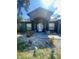 Close-up front entrance featuring a decorative rock garden and seating area at 2122 Orange Tree Dr, Edgewater, FL 32141