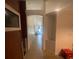 Hallway with tile flooring offering a view of the home's interior at 2122 Orange Tree Dr, Edgewater, FL 32141