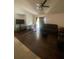Cozy living room with hardwood floors and glass doors opening to the outdoors at 2122 Orange Tree Dr, Edgewater, FL 32141