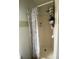 Bathroom shower stall with white shower curtain and shelves for extra storage at 2122 Orange Tree Dr, Edgewater, FL 32141
