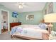 Serene bedroom with calming colors, a plush bed, and ample natural light creating a relaxing retreat at 22 Sand Dune Dr, New Smyrna Beach, FL 32169