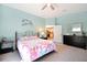 Serene bedroom features comfortable carpet and a charming fish art piece at 22 Sand Dune Dr, New Smyrna Beach, FL 32169