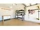 Garage featuring white concrete block walls, overhead lighting, and a work bench at 22 Sand Dune Dr, New Smyrna Beach, FL 32169