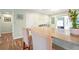 Charming kitchen featuring an island, stainless steel appliances, and a seamless flow to the living spaces at 22 Sand Dune Dr, New Smyrna Beach, FL 32169