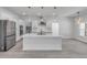 Bright kitchen with a center island, stainless steel appliances, and pendant lighting at 2324 Orange Tree Dr, Edgewater, FL 32141
