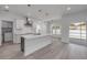 Modern kitchen with a large island, white cabinets, and stainless steel appliances at 2324 Orange Tree Dr, Edgewater, FL 32141