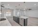 Open kitchen featuring an island with a breakfast bar and modern pendant lighting at 2324 Orange Tree Dr, Edgewater, FL 32141