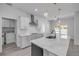 Modern kitchen with white countertops, stainless appliances and an adjacent dining area at 2324 Orange Tree Dr, Edgewater, FL 32141