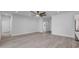 Bright living room showcasing light gray flooring, recessed lighting, and open layout at 2324 Orange Tree Dr, Edgewater, FL 32141