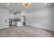 Open-concept living area features a kitchenette with stainless steel appliances and modern finishes at 2324 Orange Tree Dr, Edgewater, FL 32141