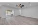 View of the living room featuring sliding glass doors and light gray flooring at 2324 Orange Tree Dr, Edgewater, FL 32141