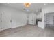 Spacious living room with light gray flooring and white walls for a bright and airy feel at 2324 Orange Tree Dr, Edgewater, FL 32141