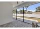 View of the paved patio with an adjacent fence, providing a private outdoor space at 2324 Orange Tree Dr, Edgewater, FL 32141