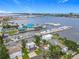 Waterfront view of homes near the marina with docked boats and a blue restaurant building on the water at 255 Lexington Dr, Daytona Beach, FL 32114