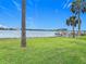 Expansive backyard offering stunning waterfront views and a private dock at 255 Lexington Dr, Daytona Beach, FL 32114