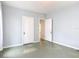 A clean bedroom with ample closet space and a hallway entrance at 255 Lexington Dr, Daytona Beach, FL 32114
