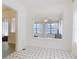 Bright dining room with black and white tile and large windows providing water views at 255 Lexington Dr, Daytona Beach, FL 32114