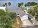 Scenic waterfront home boasting a garage and bay views, surrounded by lush greenery and neighborhood charm at 255 Lexington Dr, Daytona Beach, FL 32114