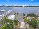 Scenic waterfront home boasting a garage and bay views, surrounded by lush greenery and neighborhood charm at 255 Lexington Dr, Daytona Beach, FL 32114